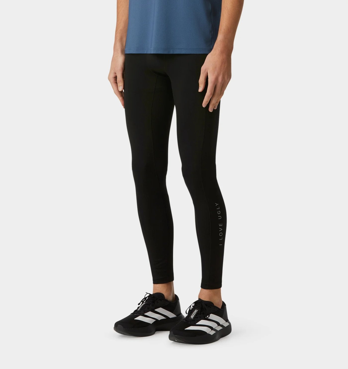 Black full-length compression tight with reflective calf wordmark