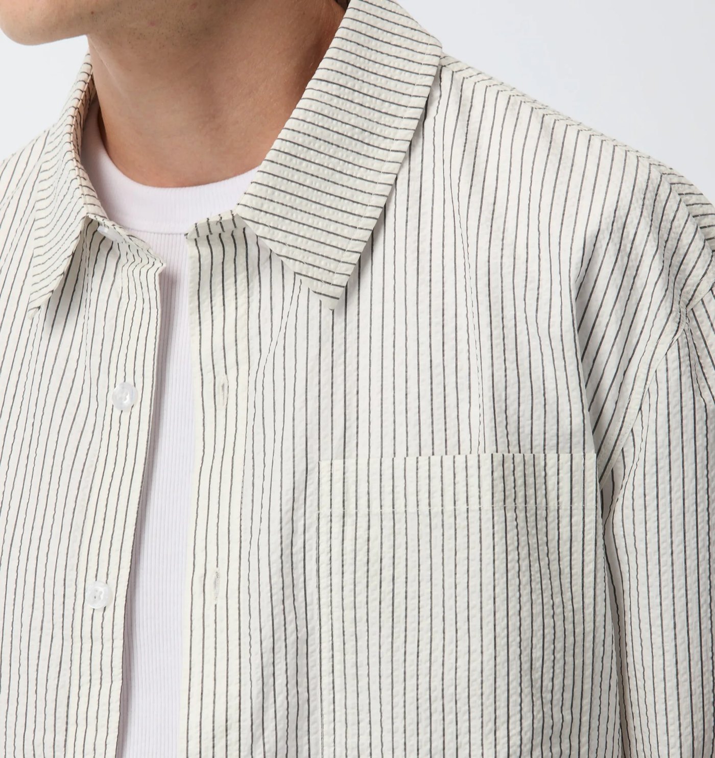 Close-up of the seersucker pinstripe collar and chest pocket