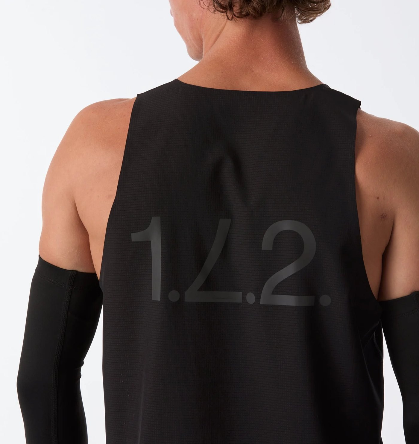 Back of the performance tank with tonal 1.L.2. print