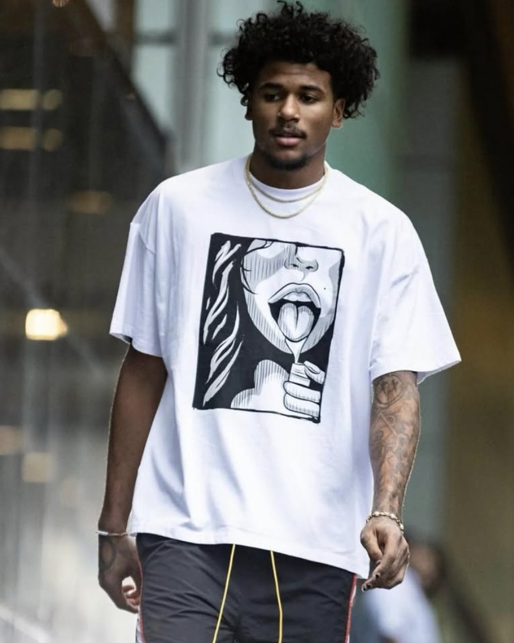 White oversized tee with a black and white pop art portrait graphic