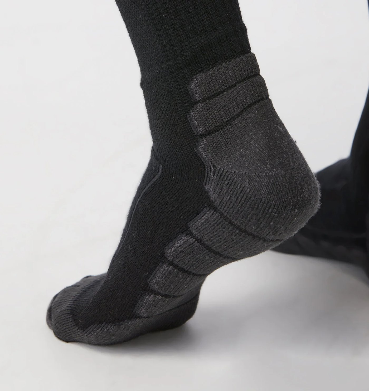 Close-up of the cushioned heel and sole zones on the worn sock