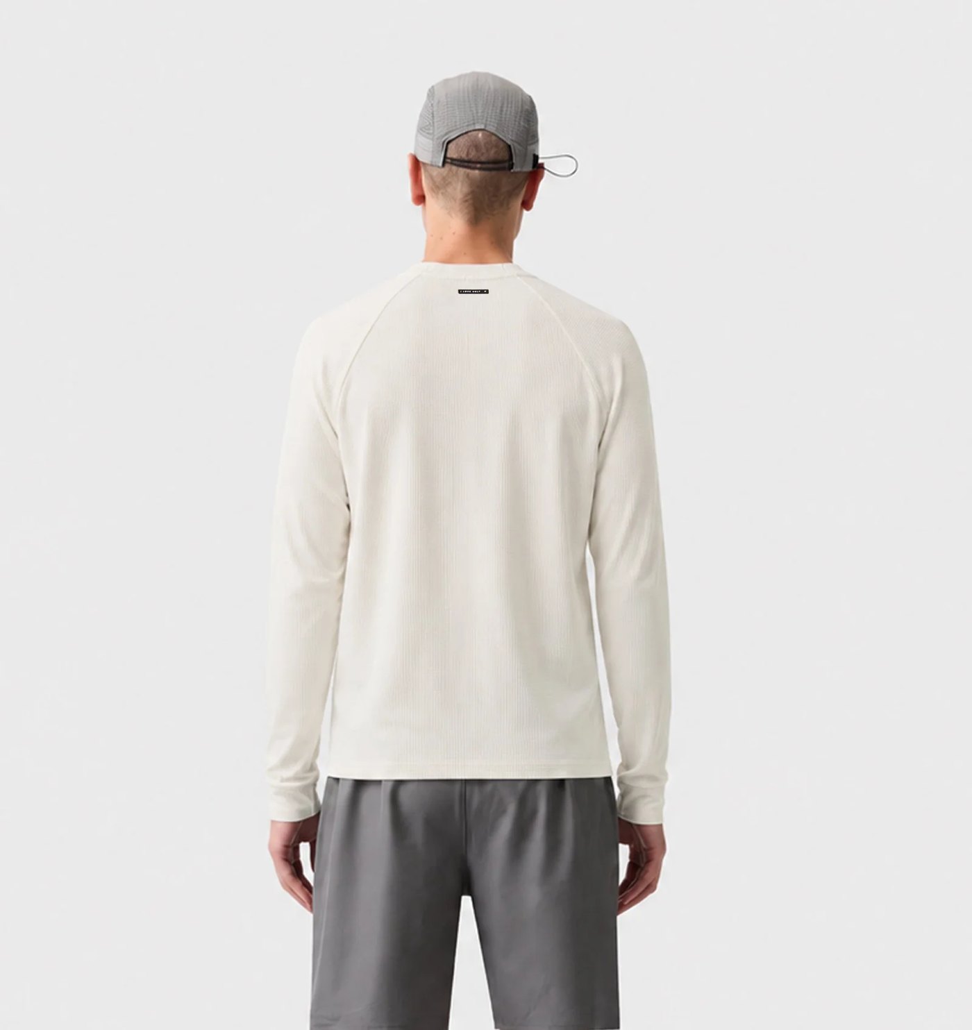 Back view of the waffle thermal showing the raglan seams and neck label