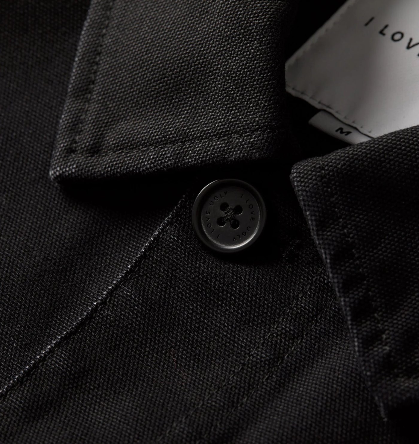 Close-up of the Chore Jacket collar, canvas weave and branded button