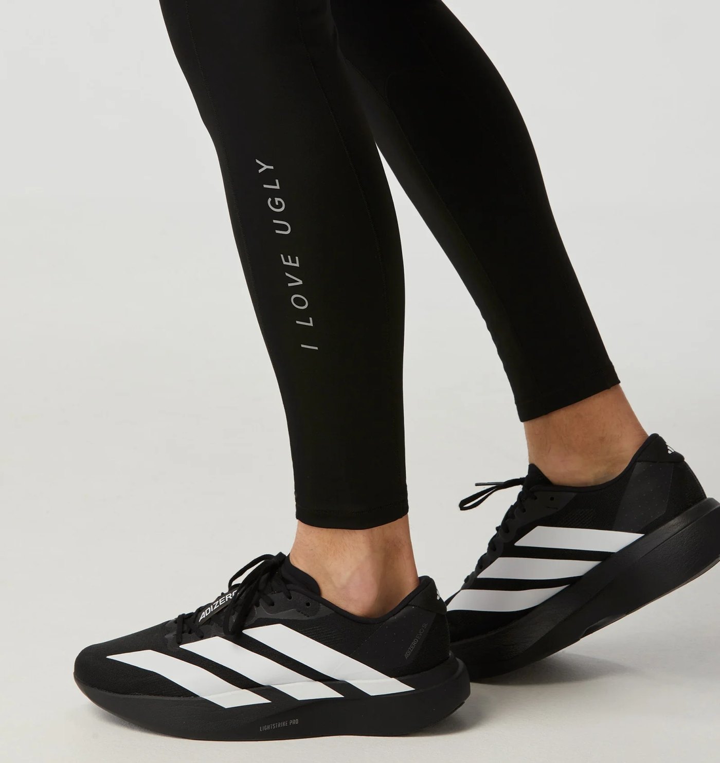 Close-up of the reflective vertical wordmark on the lower leg