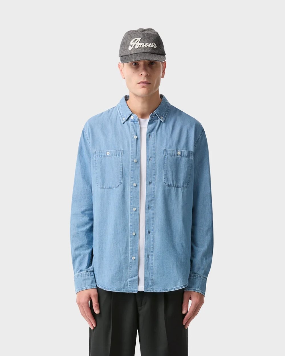 Light wash denim chambray button-down shirt with twin chest pockets