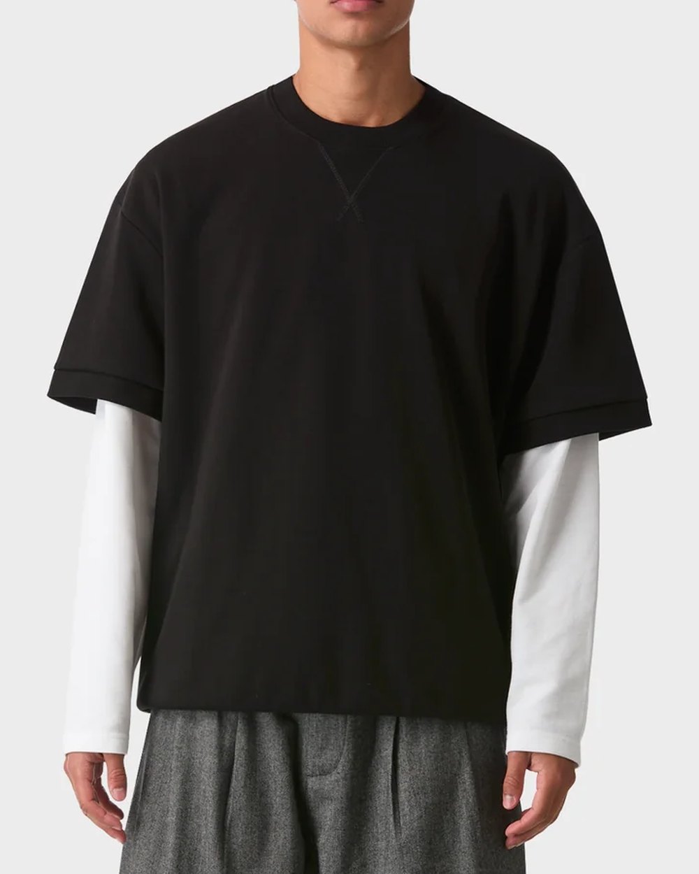 Black cuff tee layered over a white long sleeve