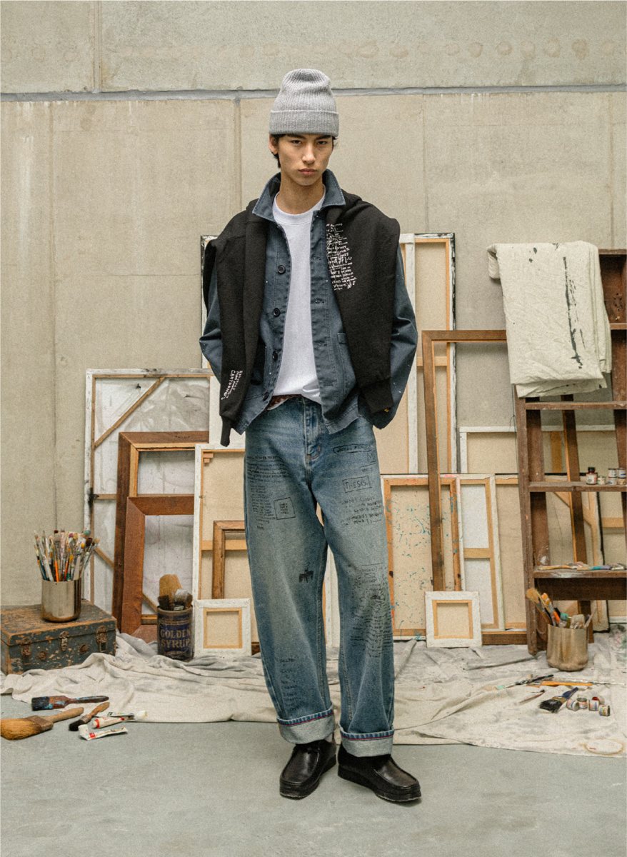 I Love Ugly x Jean-Michel Basquiat: Black printed vest over a denim shirt with Basquiat script-print jeans