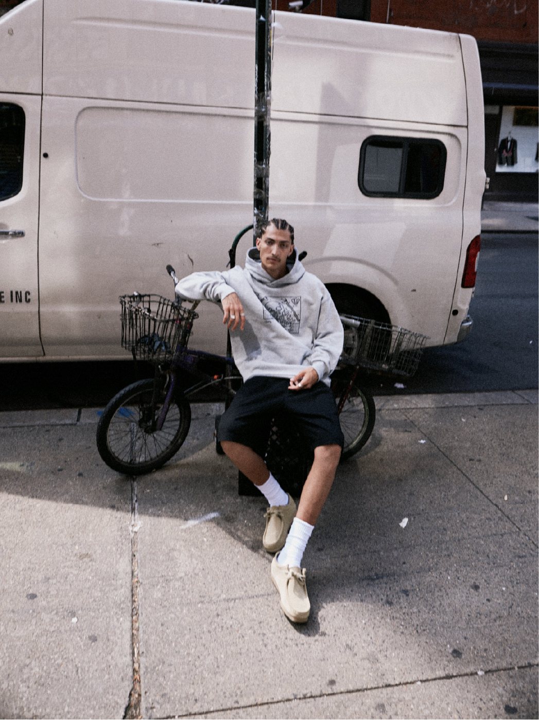 I Love Ugly x Keith Haring: Grey crewneck and black shorts with a bike