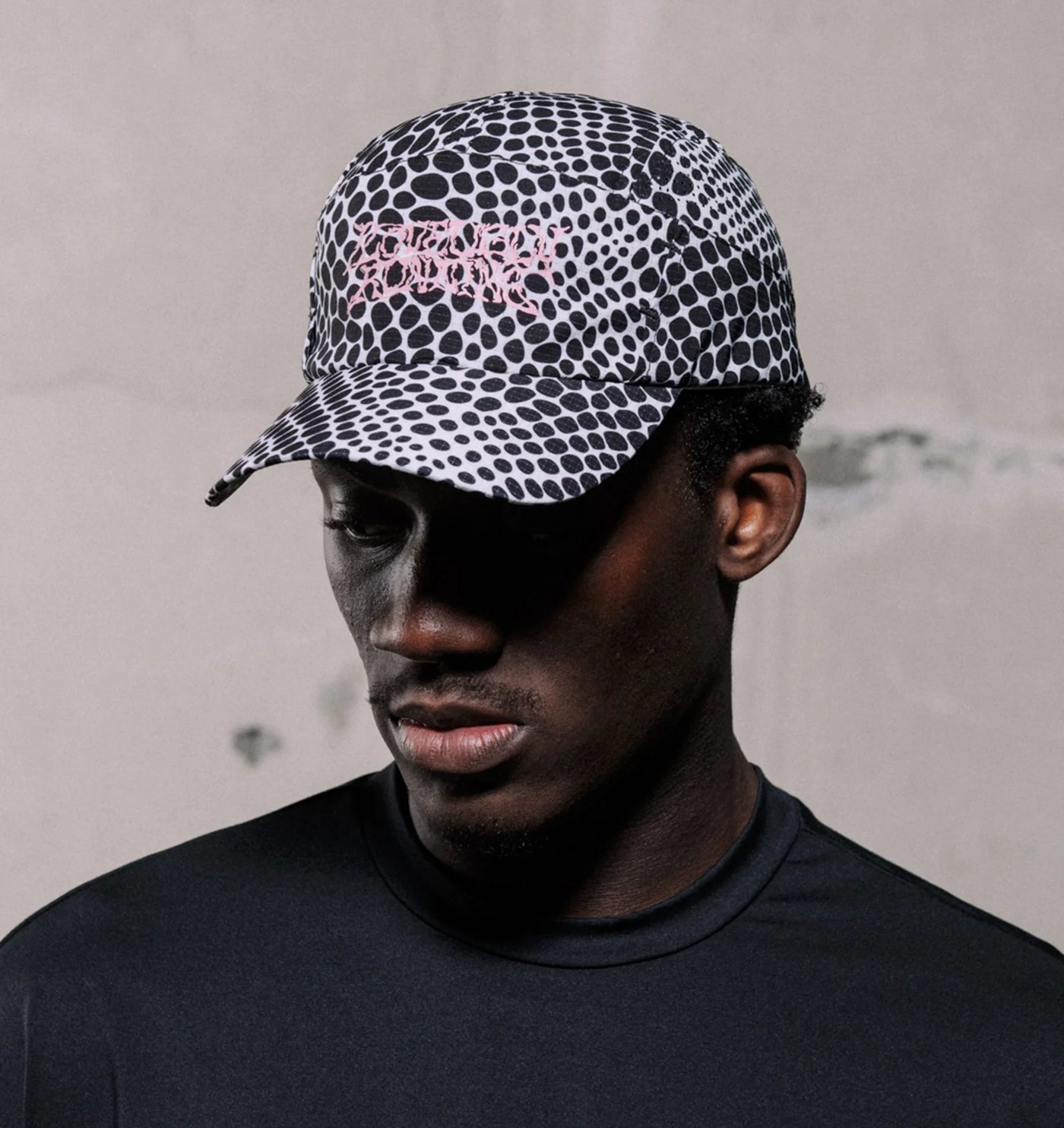 Snakeskin print performance cap with pink liquified Love Ugly Running graphic