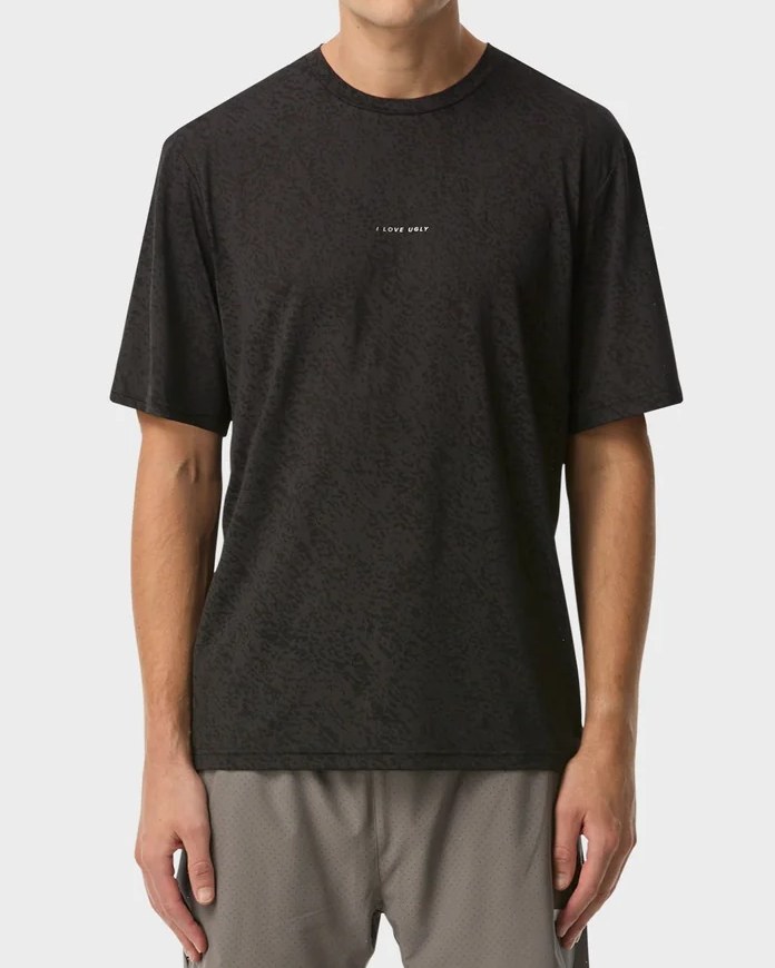Black lace jacquard active tee with small reflective chest wordmark