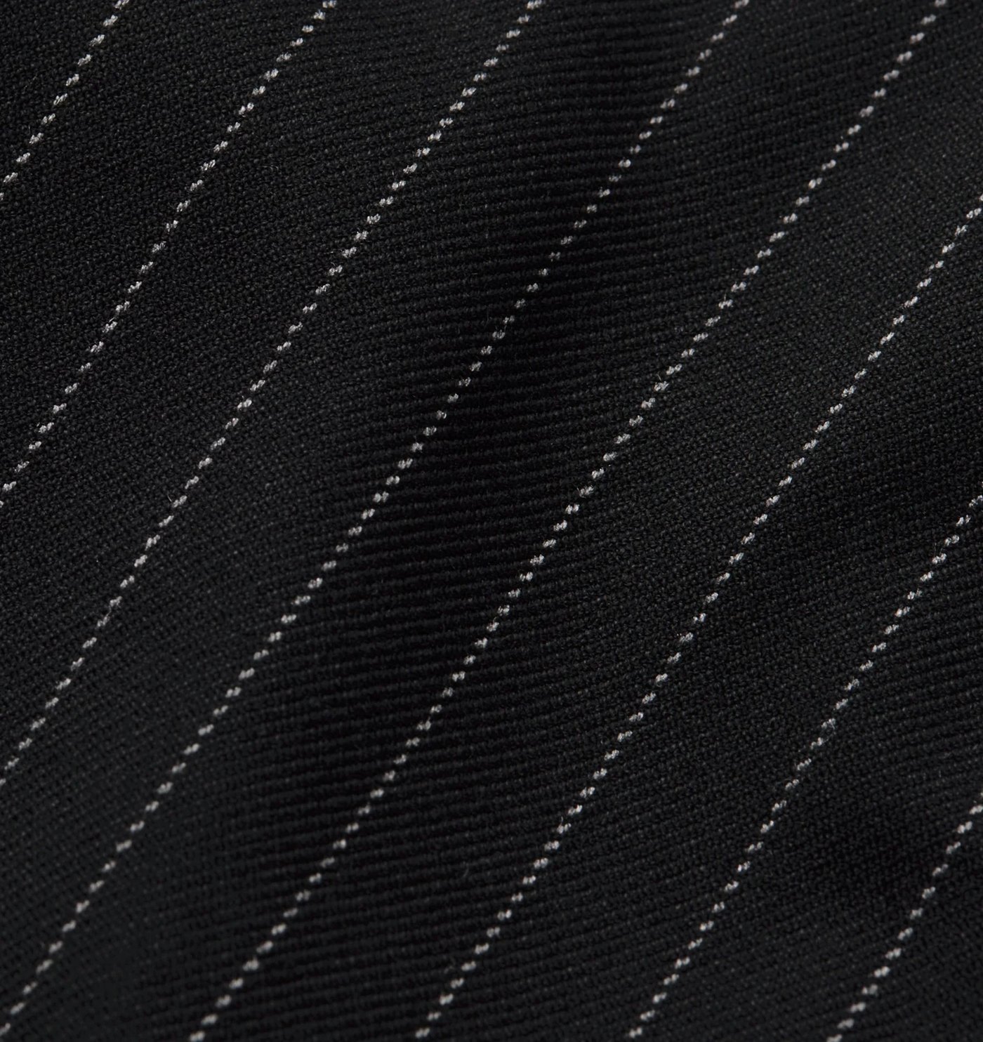 Close-up of the black pinstripe suiting fabric
