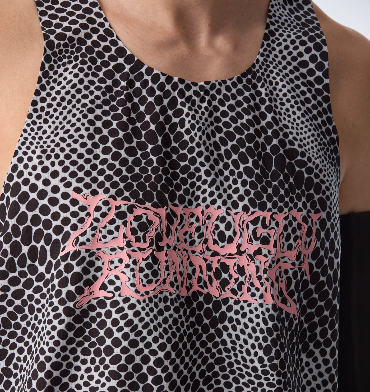 Close-up of the pink liquified lettering on the snakeskin print