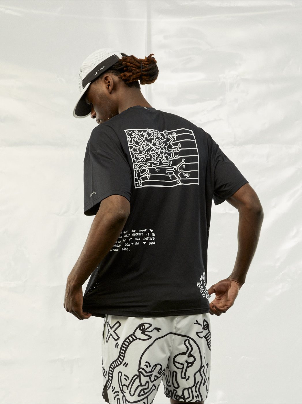 I Love Ugly x Keith Haring: Back of the black Keith Haring graphic tee with print shorts