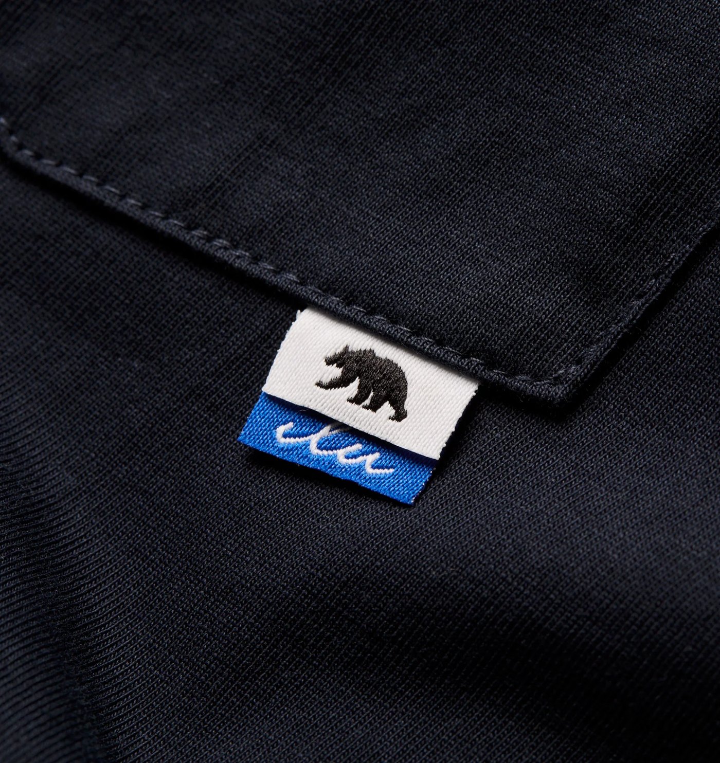 Close-up of the chest pocket and woven bear flag label