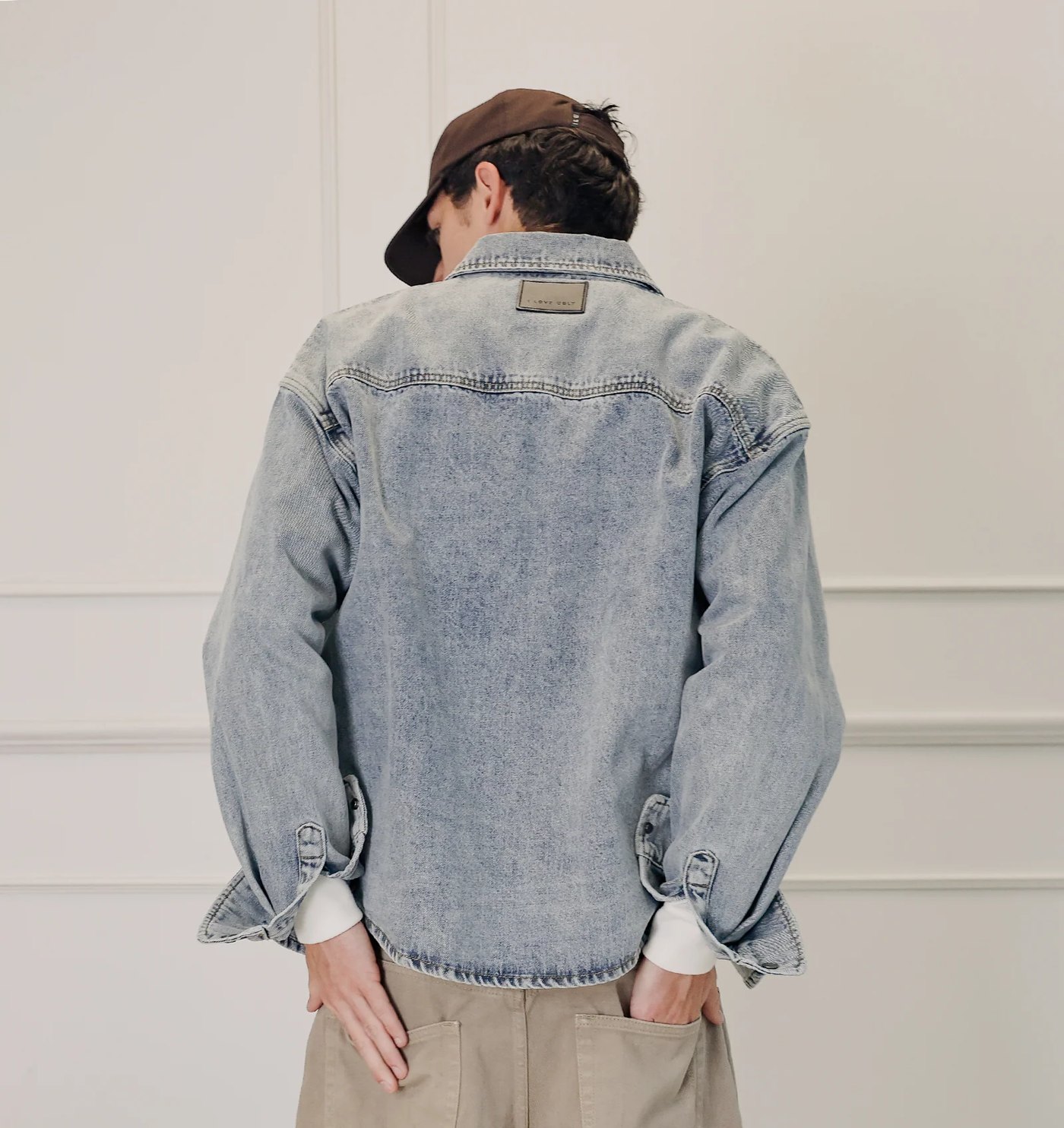 Back of the denim overshirt with yoke and leather neck patch