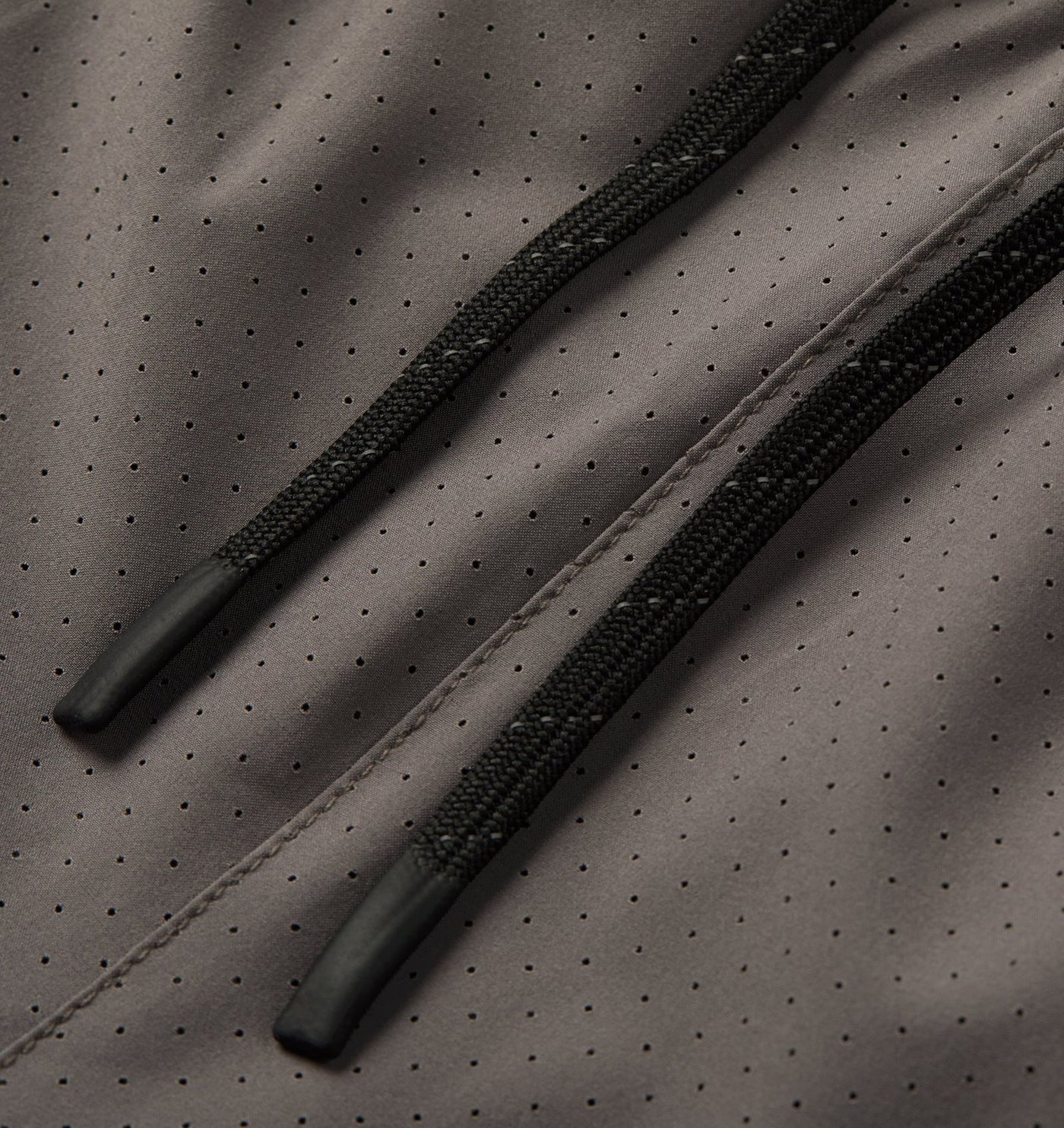 Close-up of the reflective drawcord and perforated fabric