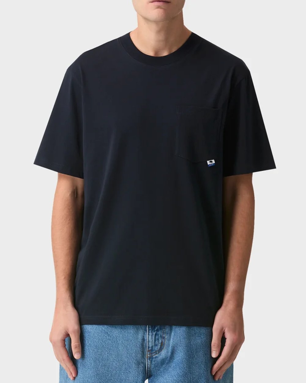 Navy heavyweight pocket tee worn with mid wash denim