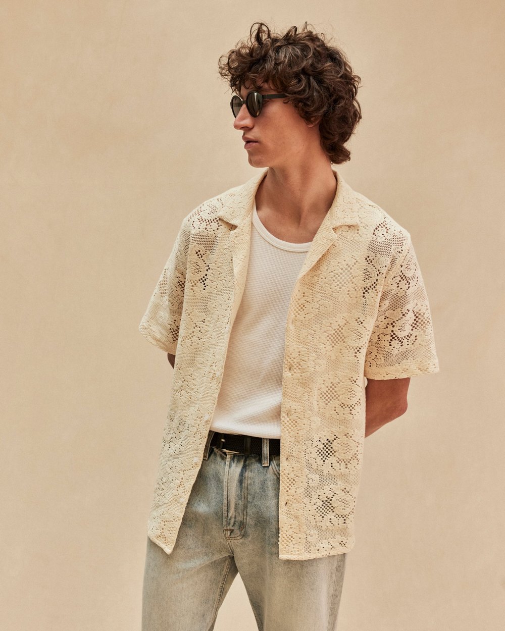 Ecru floral lace short sleeve camp collar shirt worn open over a white waffle tank