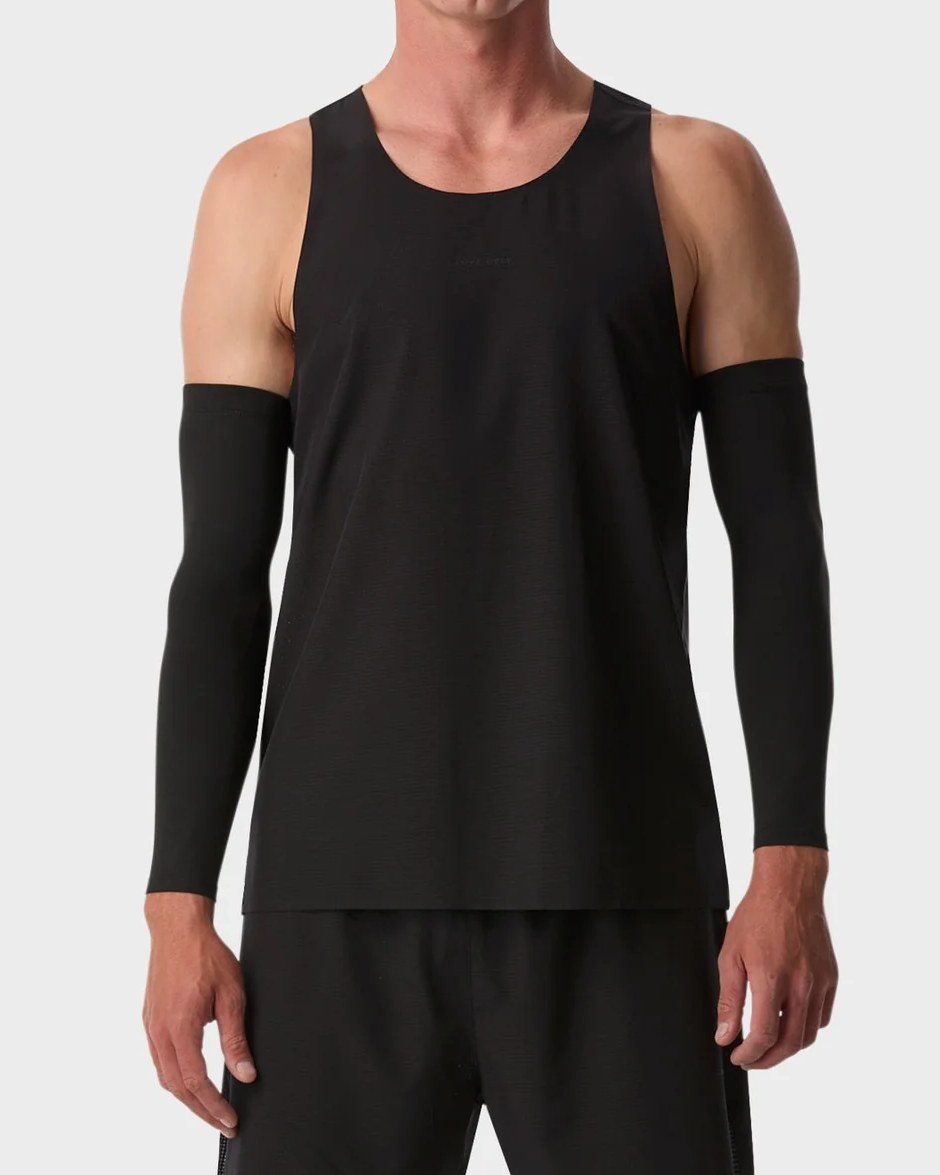 Black lightweight performance running tank worn with arm sleeves