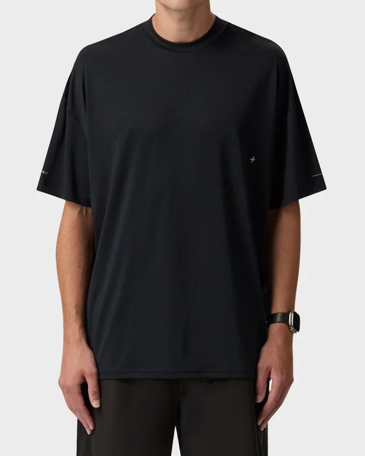 Black boxy active tee with reflective sleeve and chest marks