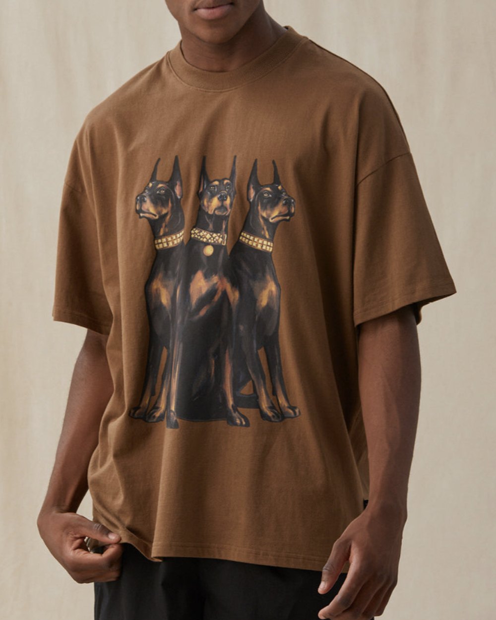 Brown oversized tee with a three Doberman graphic