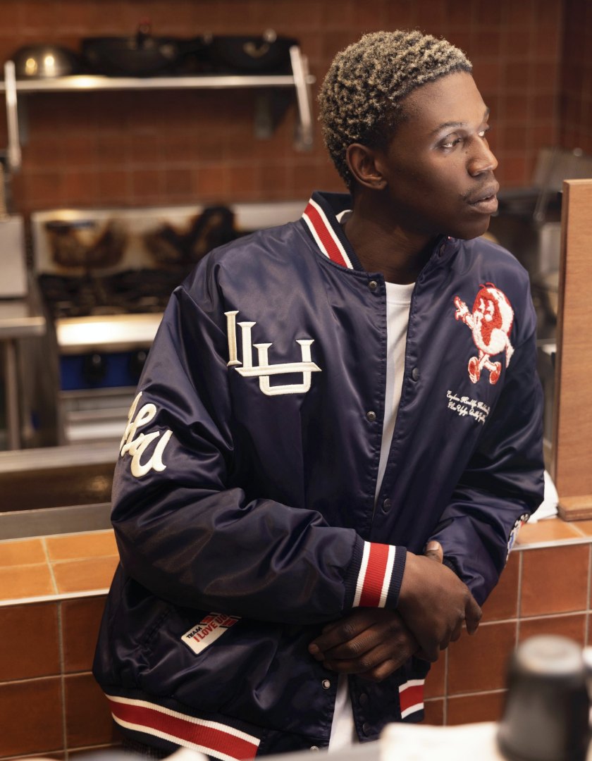 Navy satin World Wide Bomber with chenille lettering and embroidered mascot