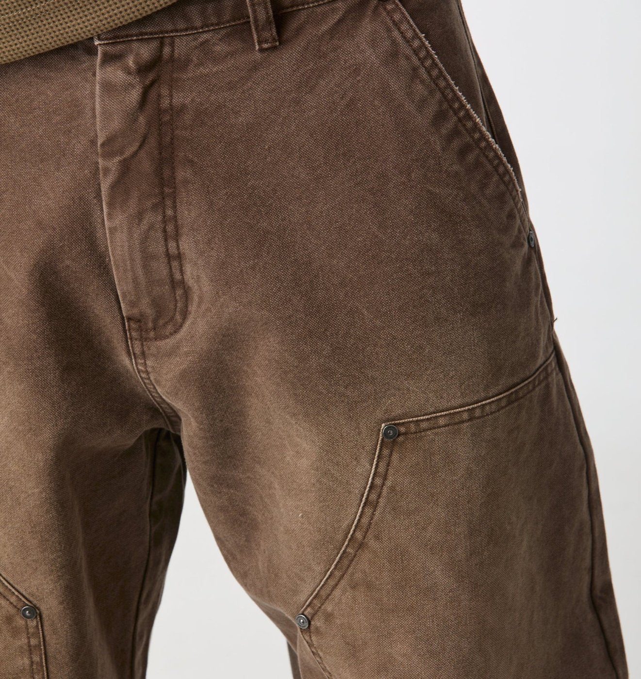 Close-up of the Balloon Double Knee Pant canvas, double knee panel and gunmetal rivets