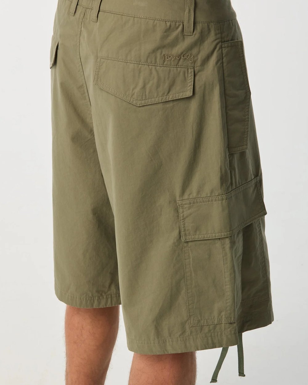 Back view of the aviator cargo short showing flap pockets and hem ties