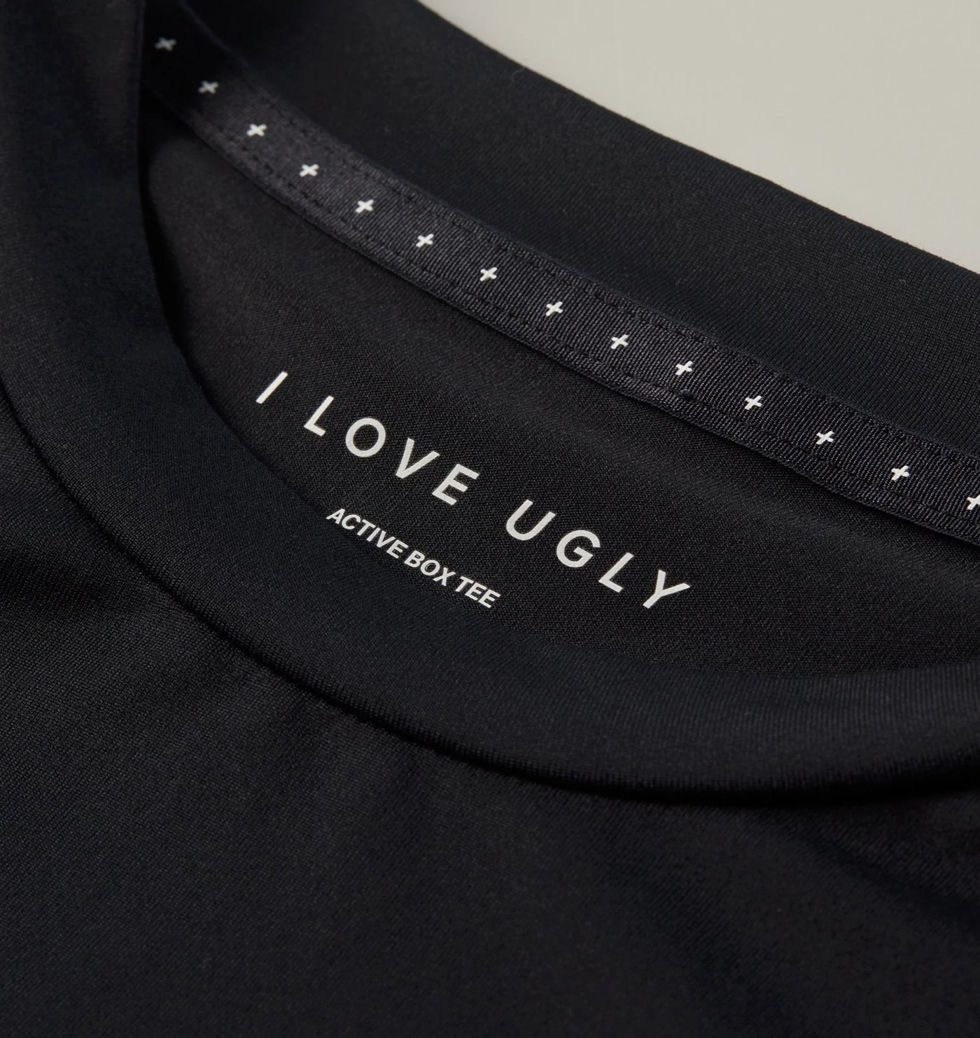 Close-up of the printed neck label and cross-print neck tape