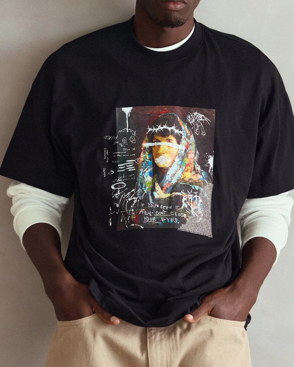 Black oversized tee with a mixed media portrait graphic