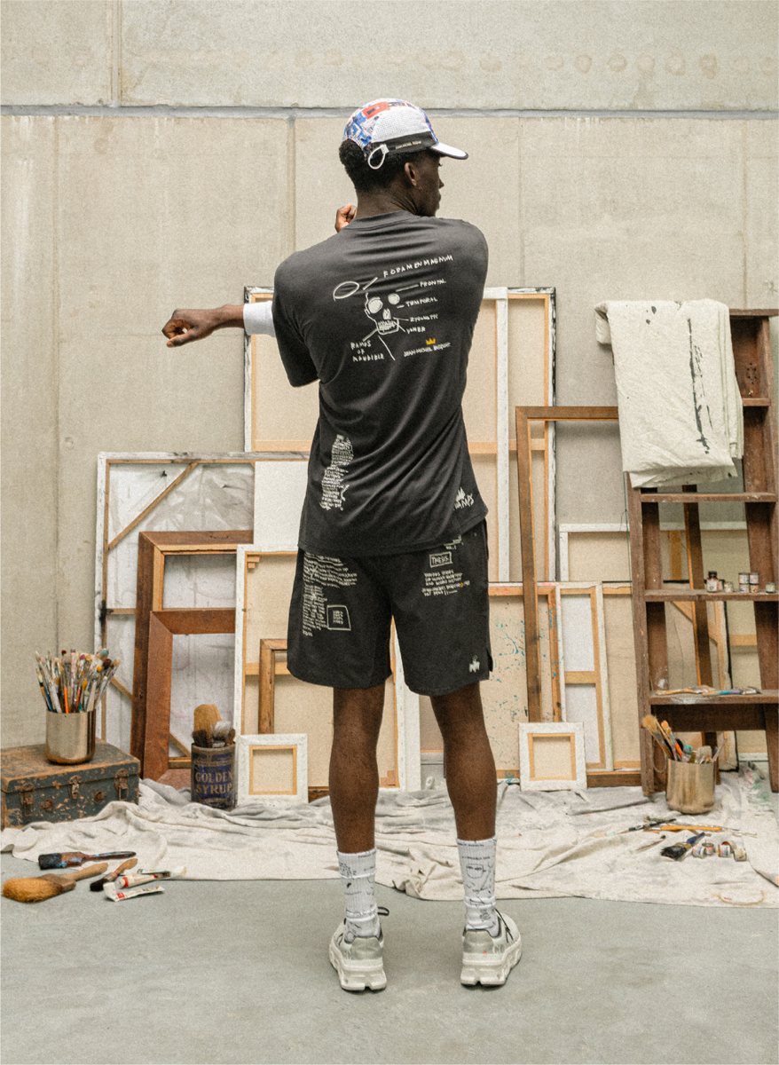 I Love Ugly x Jean-Michel Basquiat: Back of the black performance tee with Basquiat skull print and printed shorts