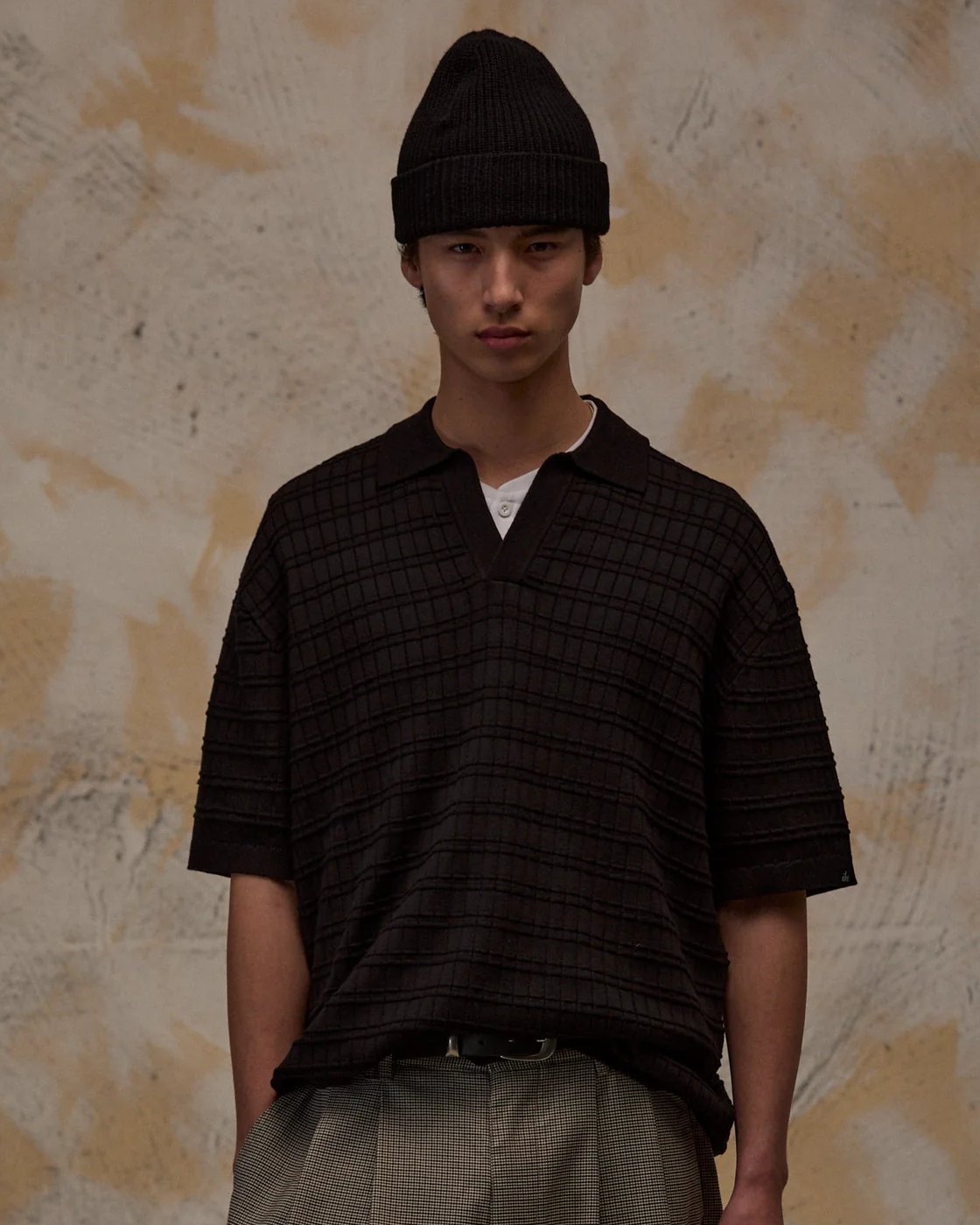 Black box-textured knit polo with open collar